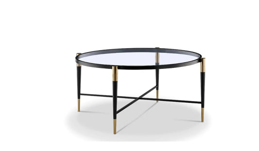 Round gold coffee table black accents